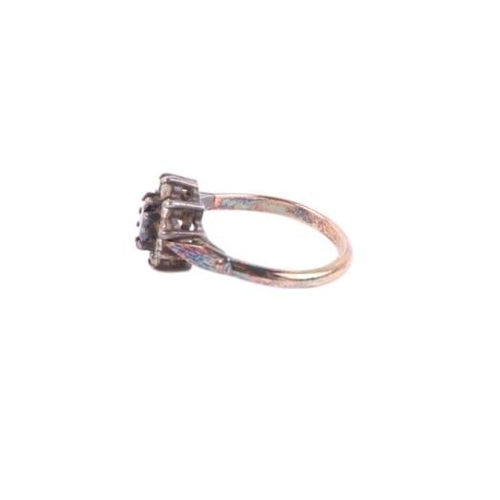 765 - A gold and silver dress ring.