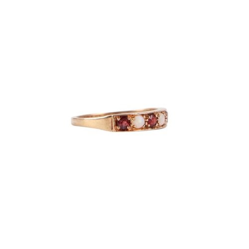 770 - A 9ct gold seven stone ruby and opal ring, approx UK size P, 2.5g.