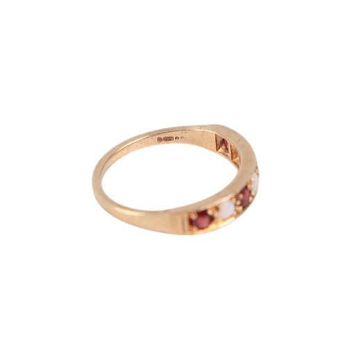 770 - A 9ct gold seven stone ruby and opal ring, approx UK size P, 2.5g.