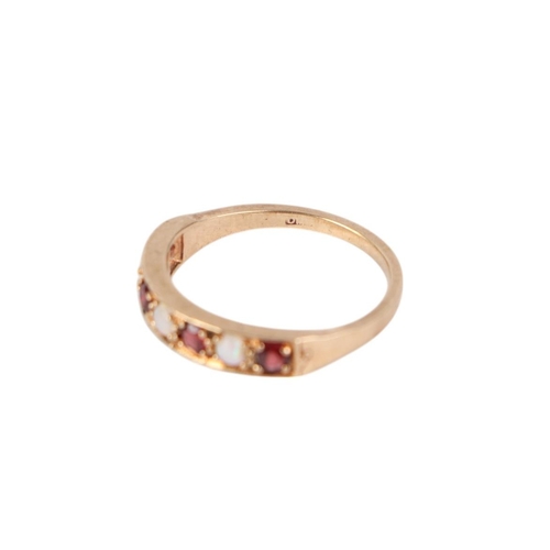 770 - A 9ct gold seven stone ruby and opal ring, approx UK size P, 2.5g.