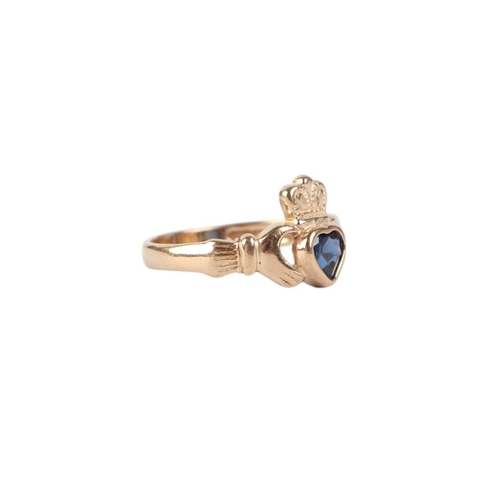 773 - A 9ct gold and sapphire heart Claddagh ring, approx UK size L, 2.1g.