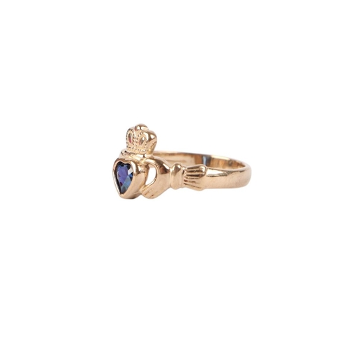 773 - A 9ct gold and sapphire heart Claddagh ring, approx UK size L, 2.1g.