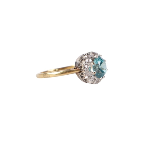 782 - An 18ct gold aquamarine and diamond cluster ring, approx UK size L, 3.5g.