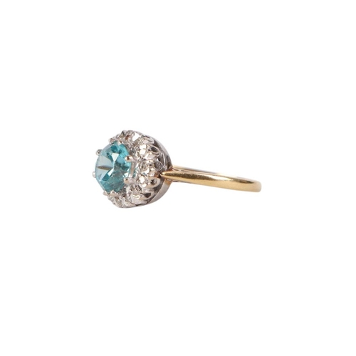 782 - An 18ct gold aquamarine and diamond cluster ring, approx UK size L, 3.5g.