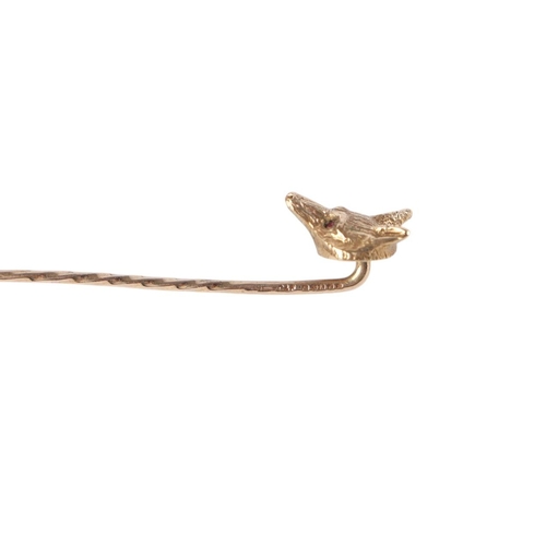 788 - A late 19th / early 20th century 9ct gold fox head stick pin with ruby set eyes, boxed, 2.6g.