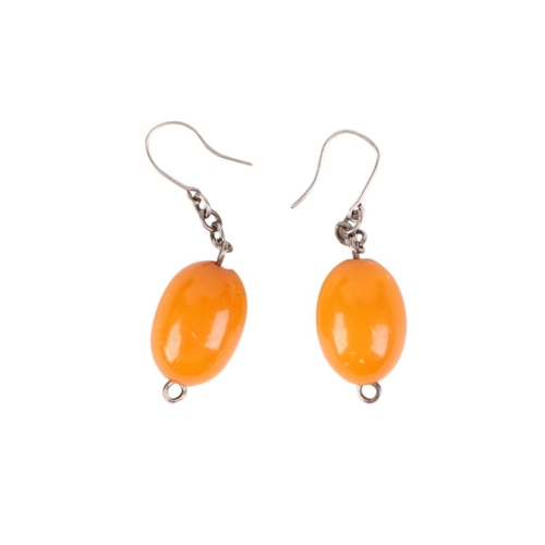 797 - A pair of egg yolk amber drop earrings.