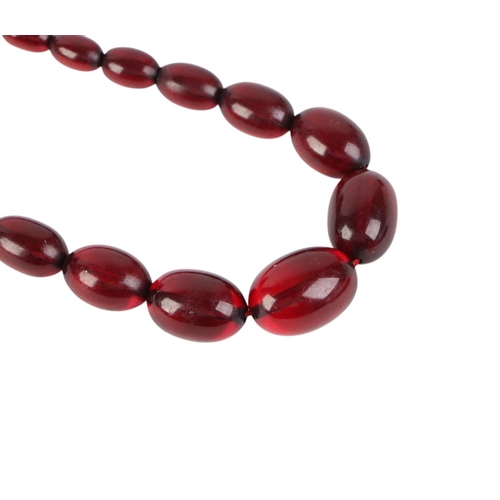 798 - A cherry amber Bakelite style graduated bead necklace,43g, 61cms long.