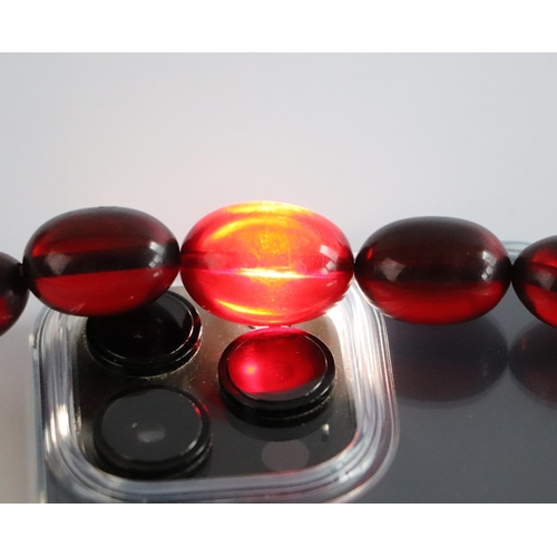 798 - A cherry amber Bakelite style graduated bead necklace,43g, 61cms long.