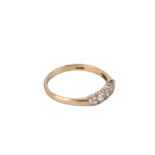 879 - A 9ct gold dress ring set with -five white stones, approx UK size N, 1.4g.