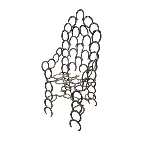 9 - A large cast iron garden chair made from horseshoes