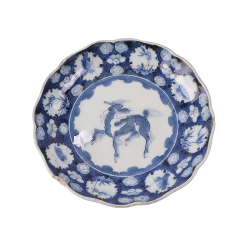 908 - A set of three Chinese blue & white porcelain plates decorated with qilin within a band of insects a... 