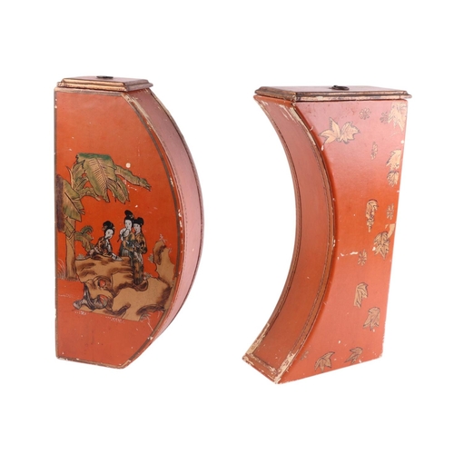 912 - A pair of chinoiserie decorated lidded boxes decorated with figures, on a red ground, 32 by 42cms.