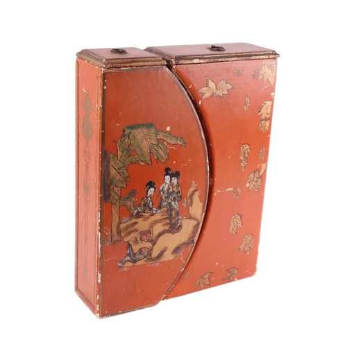 912 - A pair of chinoiserie decorated lidded boxes decorated with figures, on a red ground, 32 by 42cms.