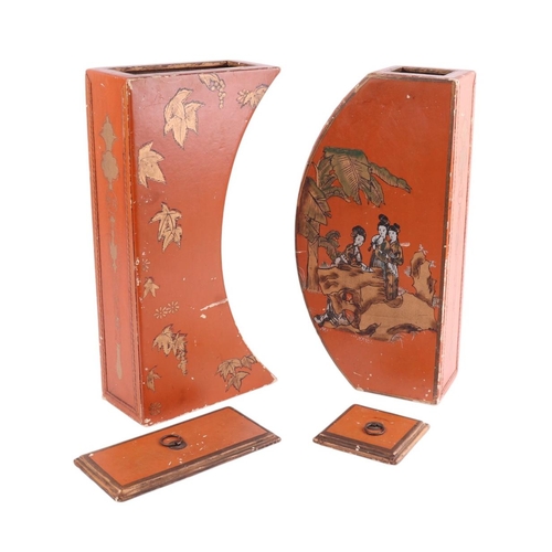 912 - A pair of chinoiserie decorated lidded boxes decorated with figures, on a red ground, 32 by 42cms.