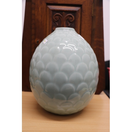 914 - A Chinese Celadon glaze vase in the form of a fir cone, 25cms high.Condition ReportGood condition wi... 