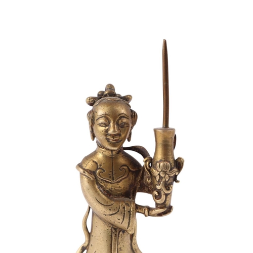 918 - A Chinese bronze / brass figure of a robed woman holding a vase, 16cms high.