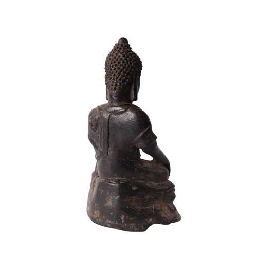 923 - A bronze figure of a seated Buddha, 19cms high.