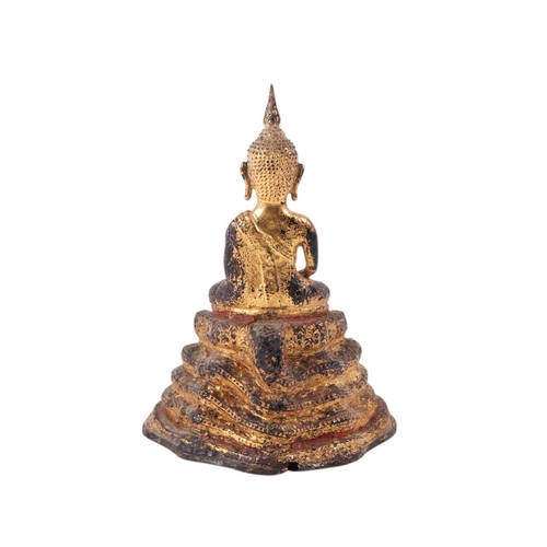 927 - A gilt bronze Thai figure of a seated Buddha on a raised stepped plinth, 16cms high.