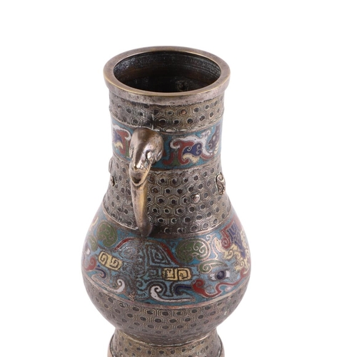 934 - A Chinese bronze / brass enamel two-handled vase, 25cms high.