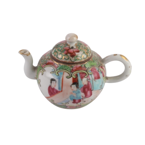 942 - A Chinese Canton Export famille rose miniature teapot; together with a pair of opium lamps; and a Ch... 