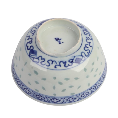 943 - A quantity of Chinese blue & white rice grain bowls, covers, side plates and spoons.