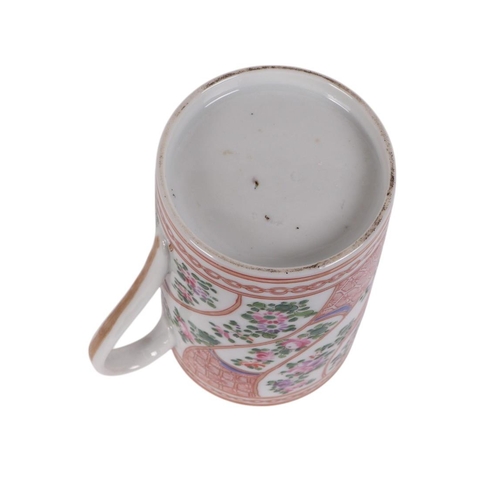 955 - A Chinese famille rose tankard, 15cms high.Condition ReportThere are two hairline cracks running dow... 