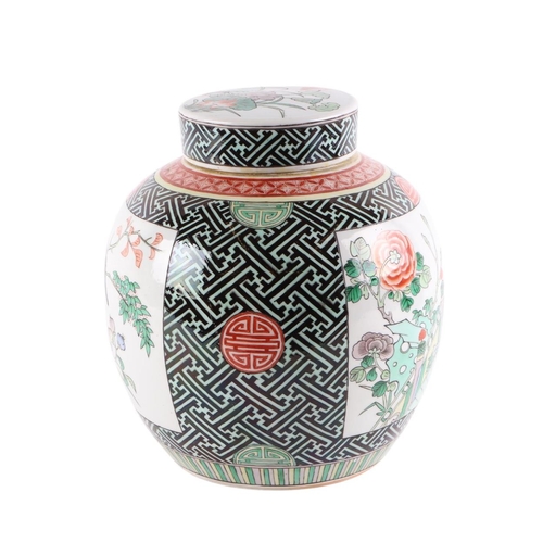 957 - A Chinese famille vert ginger jar and cover decorated with birds amongst flowering foliage, 24ins hi... 