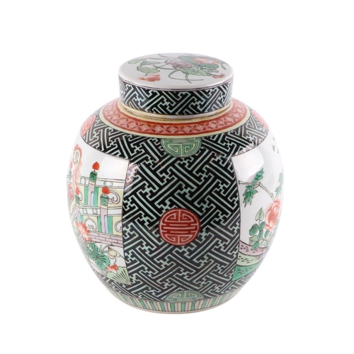 957 - A Chinese famille vert ginger jar and cover decorated with birds amongst flowering foliage, 24ins hi... 