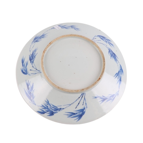 958 - A Chinese blue & white plate decorated with temple lions, 28cms diameter; together with a Chinese bl... 