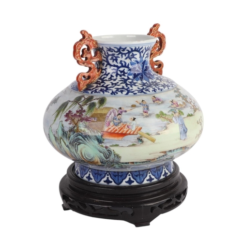 960 - A Chinese famille rose two-handled squat vase decorated with figures in a landscape, blue seal mark ... 