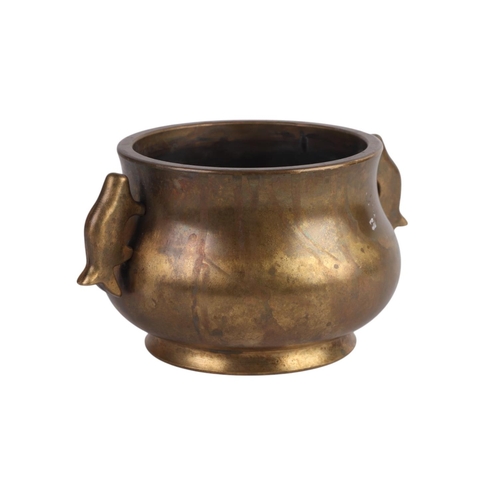 964 - A Chinese two-handled bronze censer with six character mark to the underside, 13cms diameter.