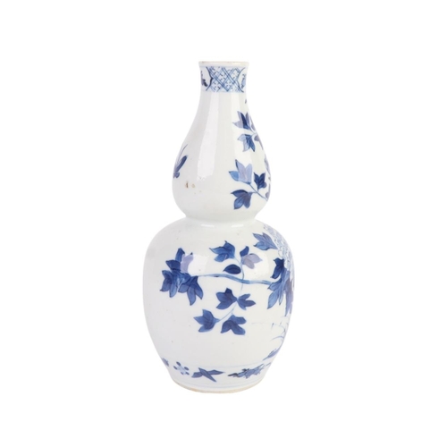 968 - A Chinese blue & white double gourd vase decorated with a bird amongst flowering foliage, four chara... 