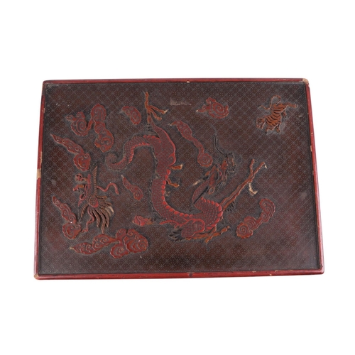 976 - A Chinese lacquer box decorated with a dragon, phoenix and tiger, 29 by 39cms; together with a Chine... 