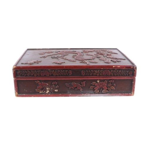 976 - A Chinese lacquer box decorated with a dragon, phoenix and tiger, 29 by 39cms; together with a Chine... 