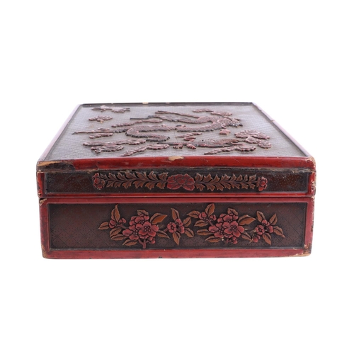 976 - A Chinese lacquer box decorated with a dragon, phoenix and tiger, 29 by 39cms; together with a Chine... 