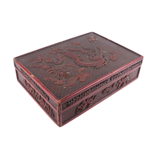 976 - A Chinese lacquer box decorated with a dragon, phoenix and tiger, 29 by 39cms; together with a Chine... 