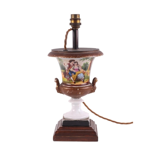 990 - A continental porcelain Campana urn type table lamp decorated with a romantic couple, 24cms high exc... 