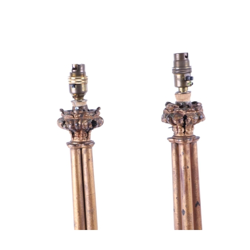 995 - A pair of gilt bronze / brass Gothic style candlesticks in the Pugin manner, converted to table lamp... 