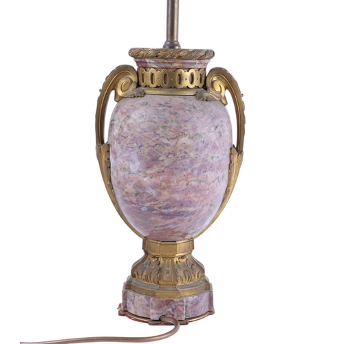 999 - A gilt bronze and rouge figured marble table lamp, 56cms high.