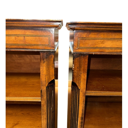 1130 - A pair of George III style figured walnut open bookcases, 108cms wide (2).