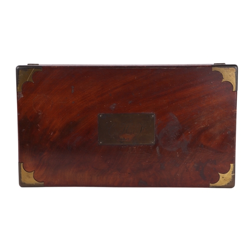 587 - A Victorian brass bound figured mahogany writing slope with secret drawer compartment, 45cms wide.