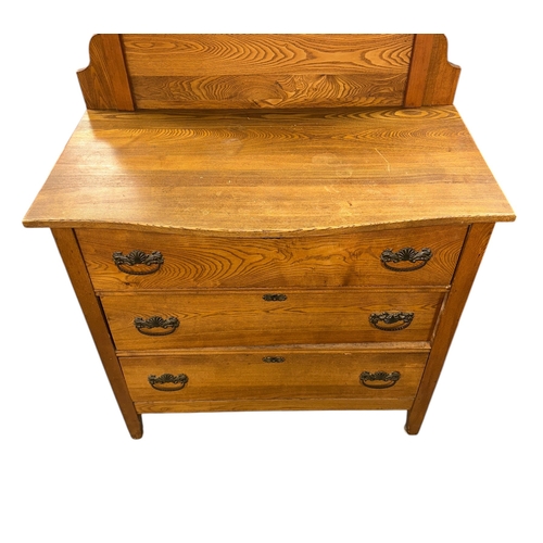 1124 - A late 19th century American oak dressing chest with three long drawers, 96cms wide.