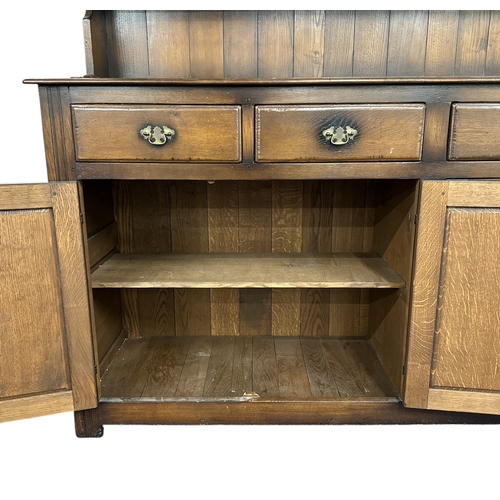 1137 - An 18th century style oak dresser, 183cms wide.