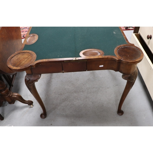 1107 - A 19th century Queen Anne style walnut concertina action card table, the quarter veneered top with c... 