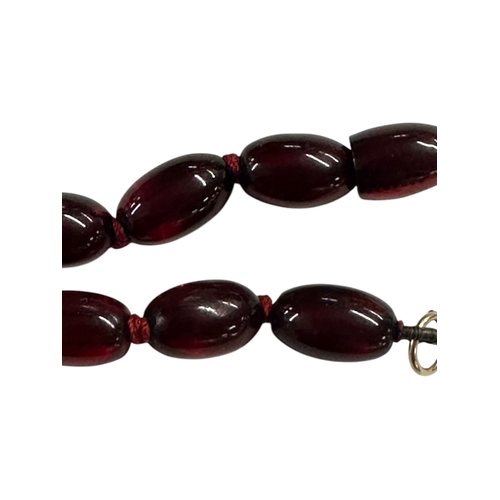 798 - A cherry amber Bakelite style graduated bead necklace,43g, 61cms long.