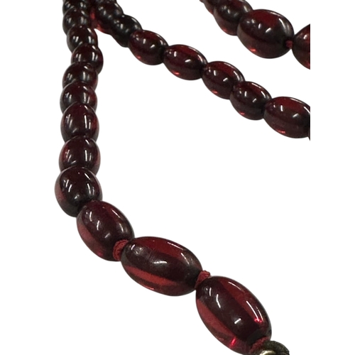 798 - A cherry amber Bakelite style graduated bead necklace,43g, 61cms long.