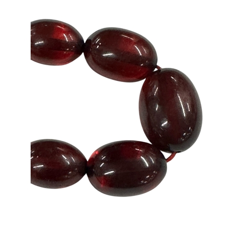 798 - A cherry amber Bakelite style graduated bead necklace,43g, 61cms long.