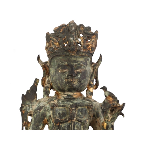 917 - A Sino-Tibetan gilt bronze figure of a seated crowned Buddha, 19cms high.Condition ReportThe base ha... 