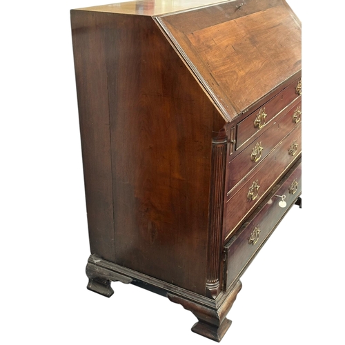 1128 - A 19th century mahogany bureau, the fall-flap enclosing a fitted interior with secret compartments, ... 