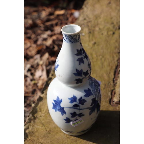 968 - A Chinese blue & white double gourd vase decorated with a bird amongst flowering foliage, four chara... 